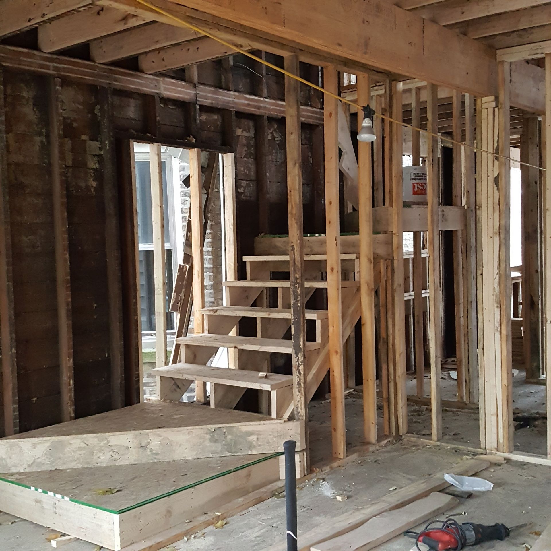 A staircase is being built in a house under construction