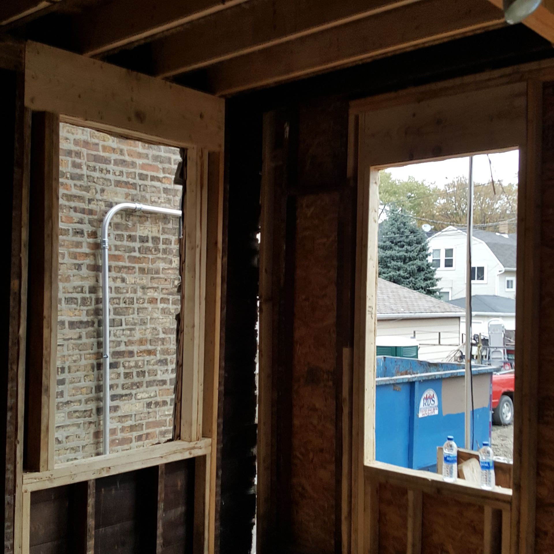 A blue trash can with the word recycle on it