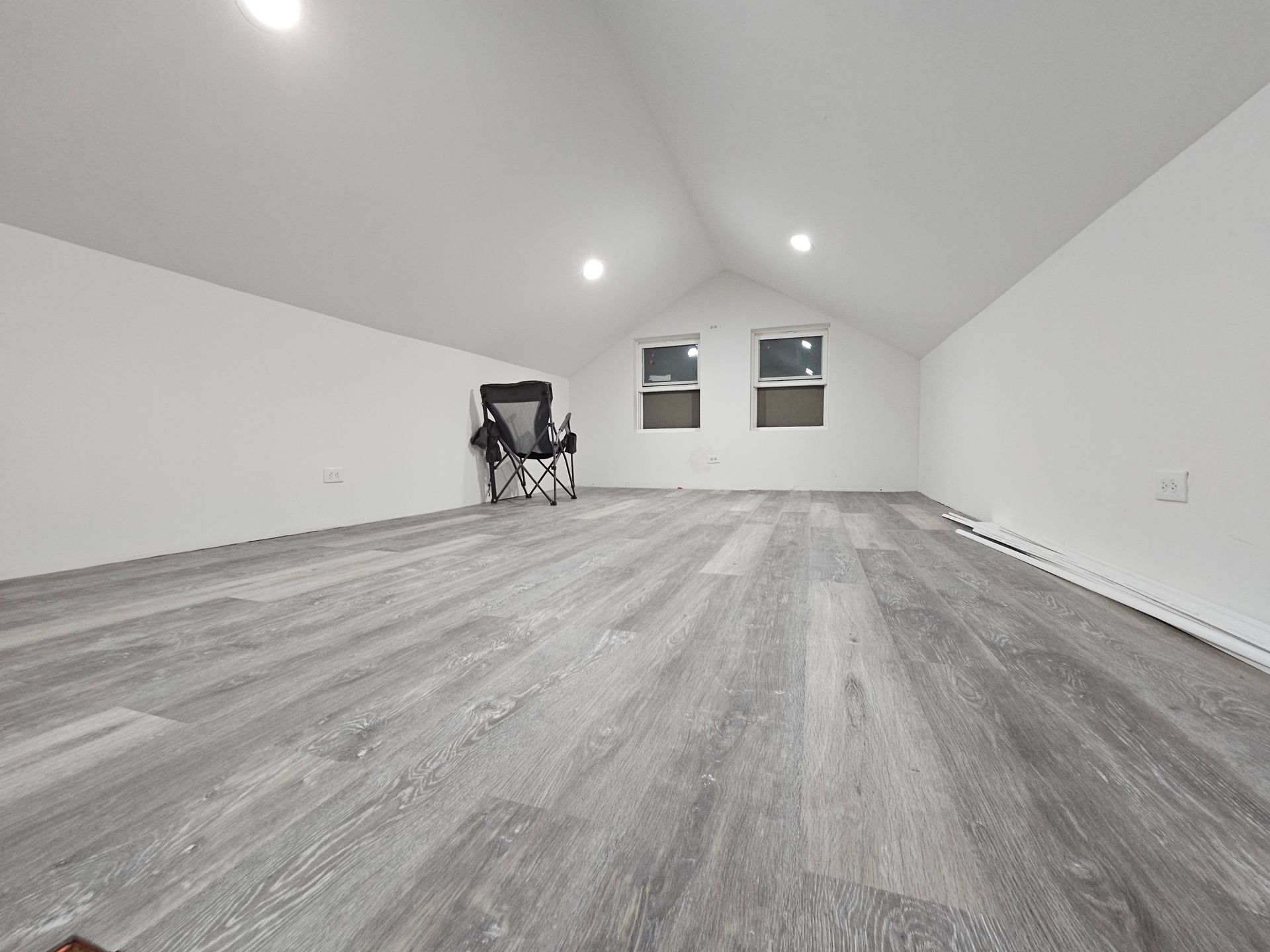 There is a chair in the middle of the room.