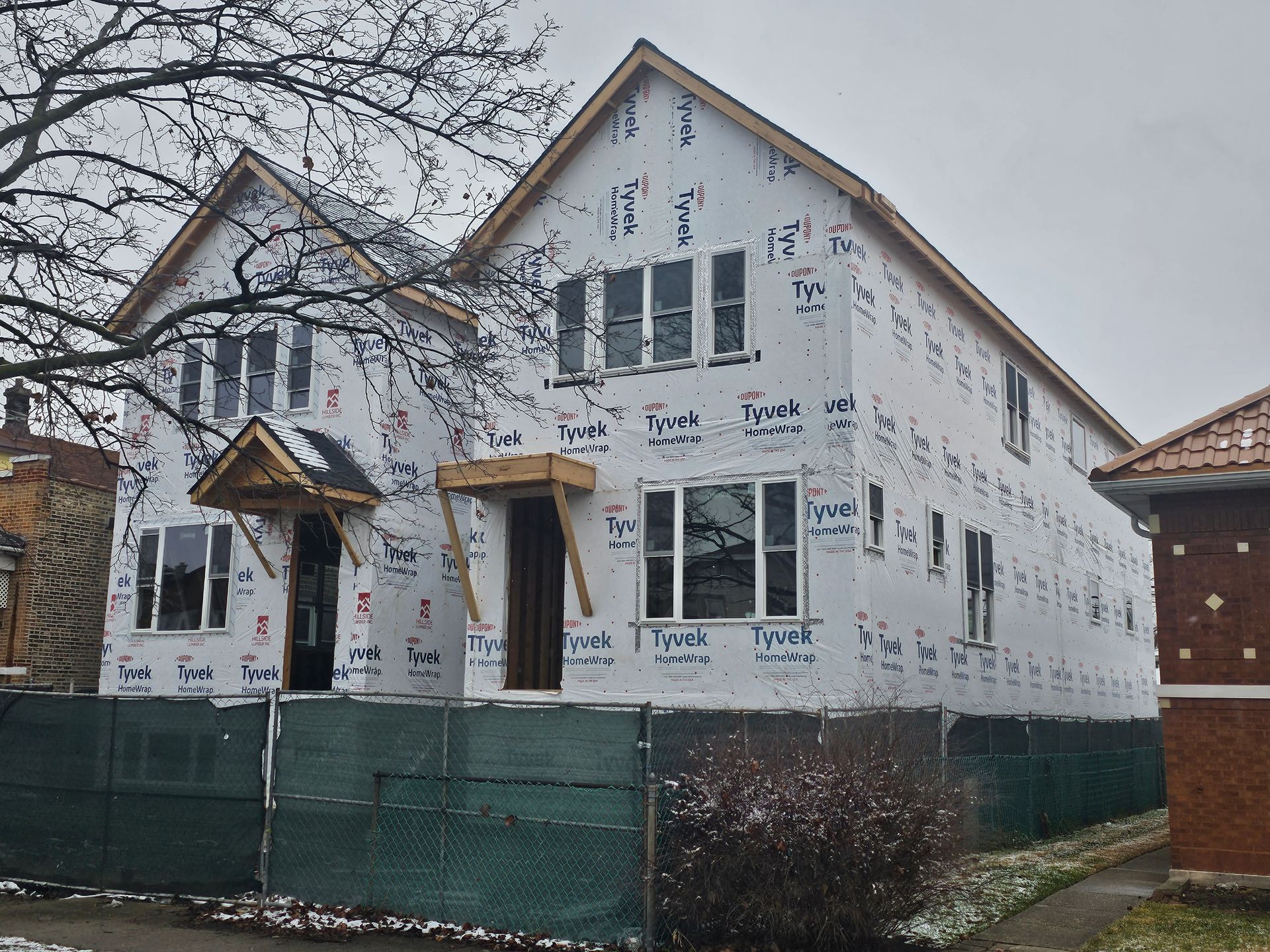 A house with a lot of windows is being built