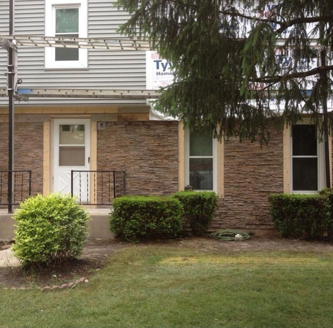 A house with a sign that says ty on it