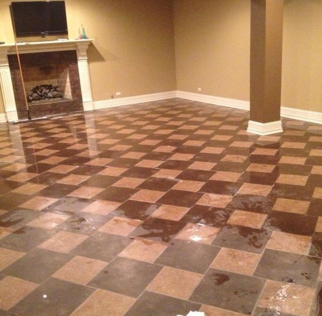 A living room with a checkered floor and a fireplace