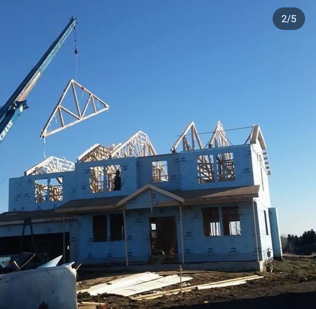 A picture of a house being built with the number 2/5 on the bottom right