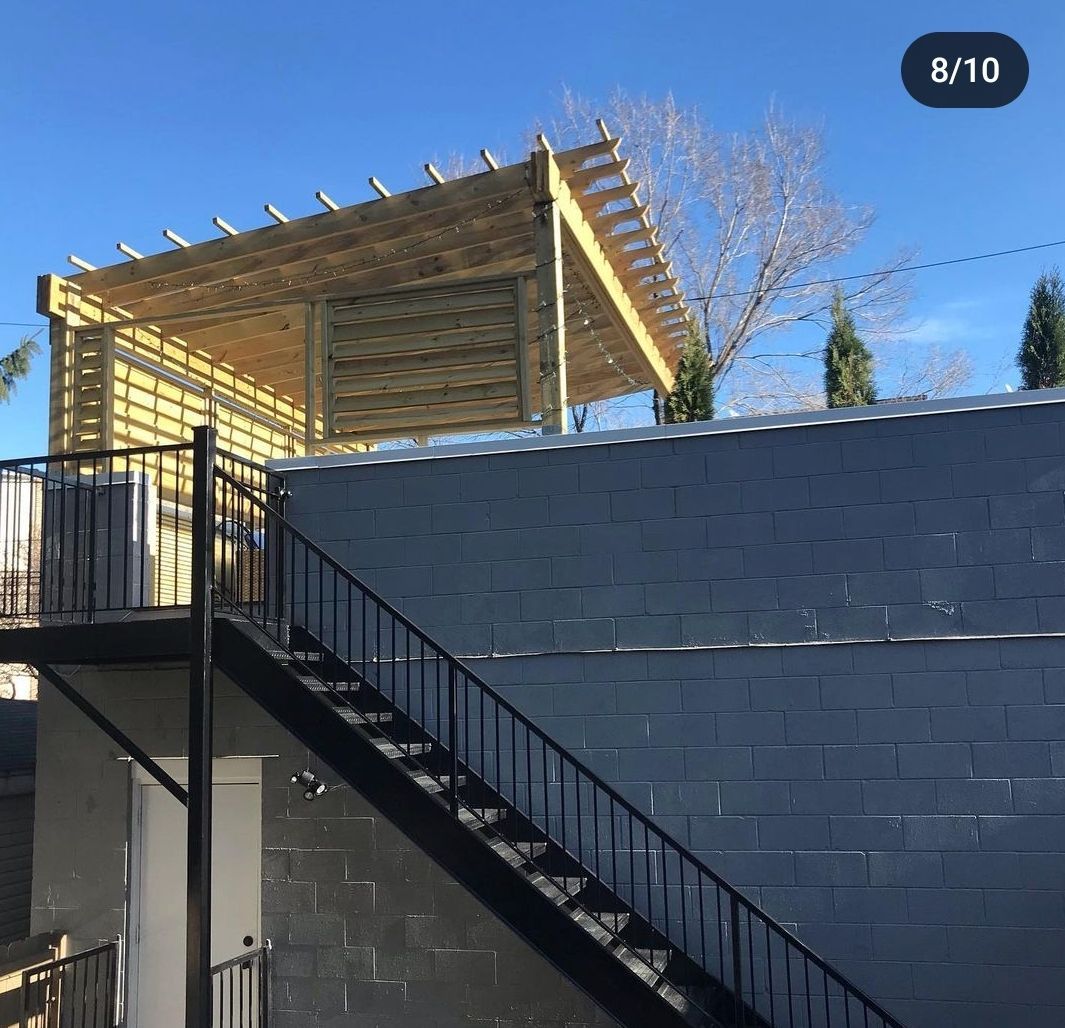 A staircase leading up to a pergola with the number 8/10 in the corner