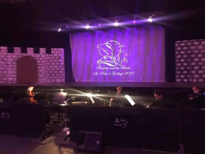 A stage with a purple projection of 