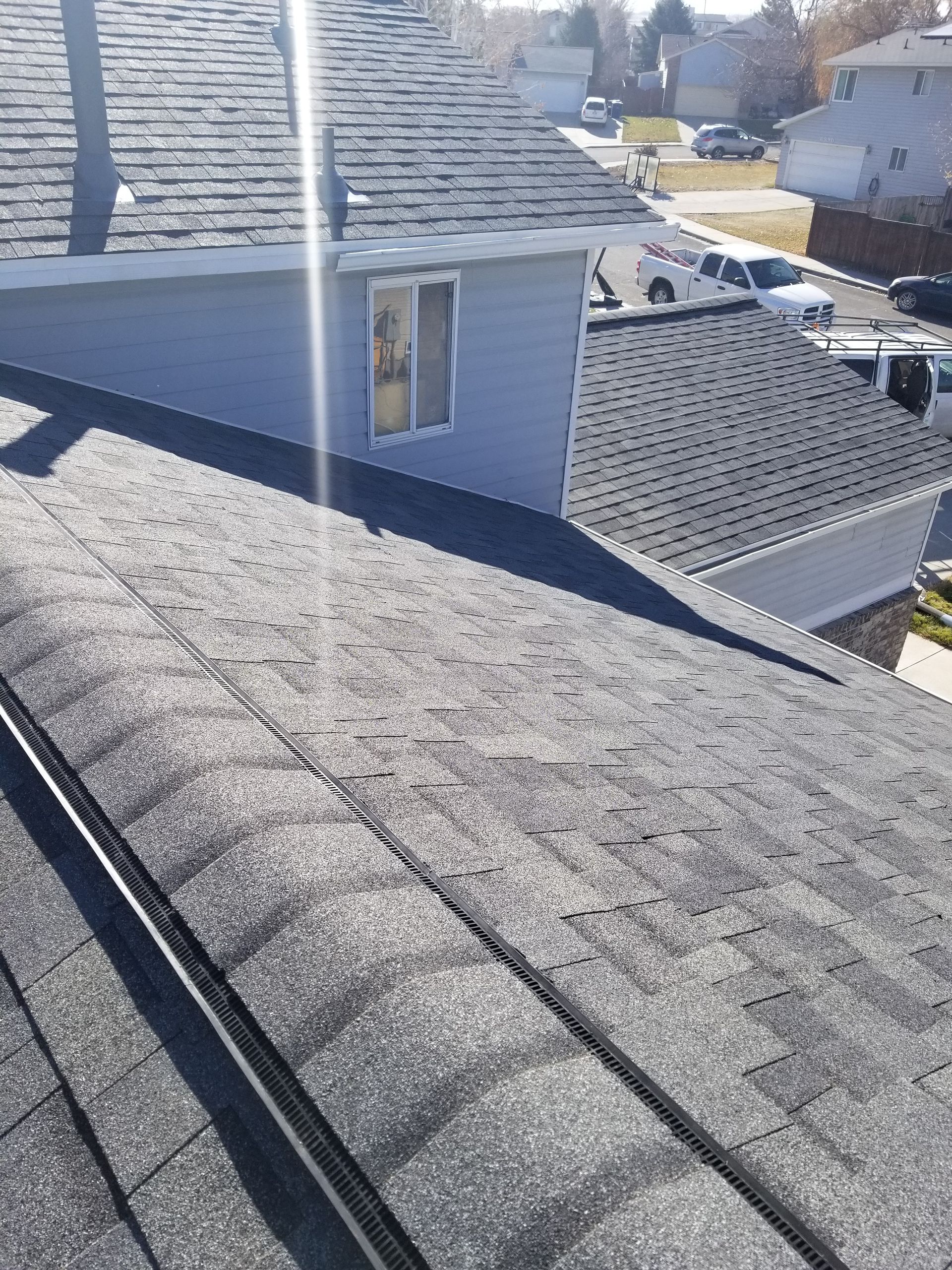 A roof of a house with a lot of shingles on it.