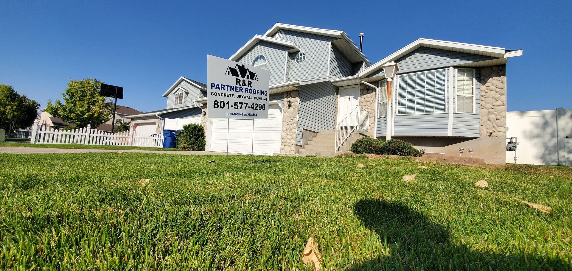 A house with a lot of grass in front of it