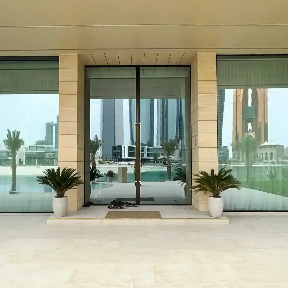 There is a sliding glass door in the middle of the room.