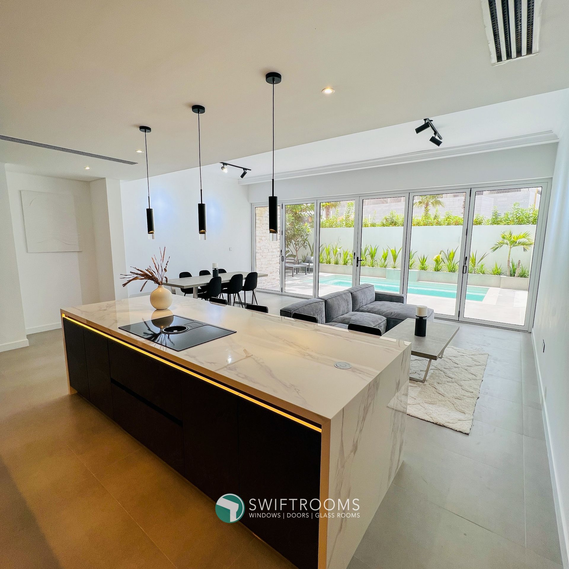 A living room with a large island in the middle