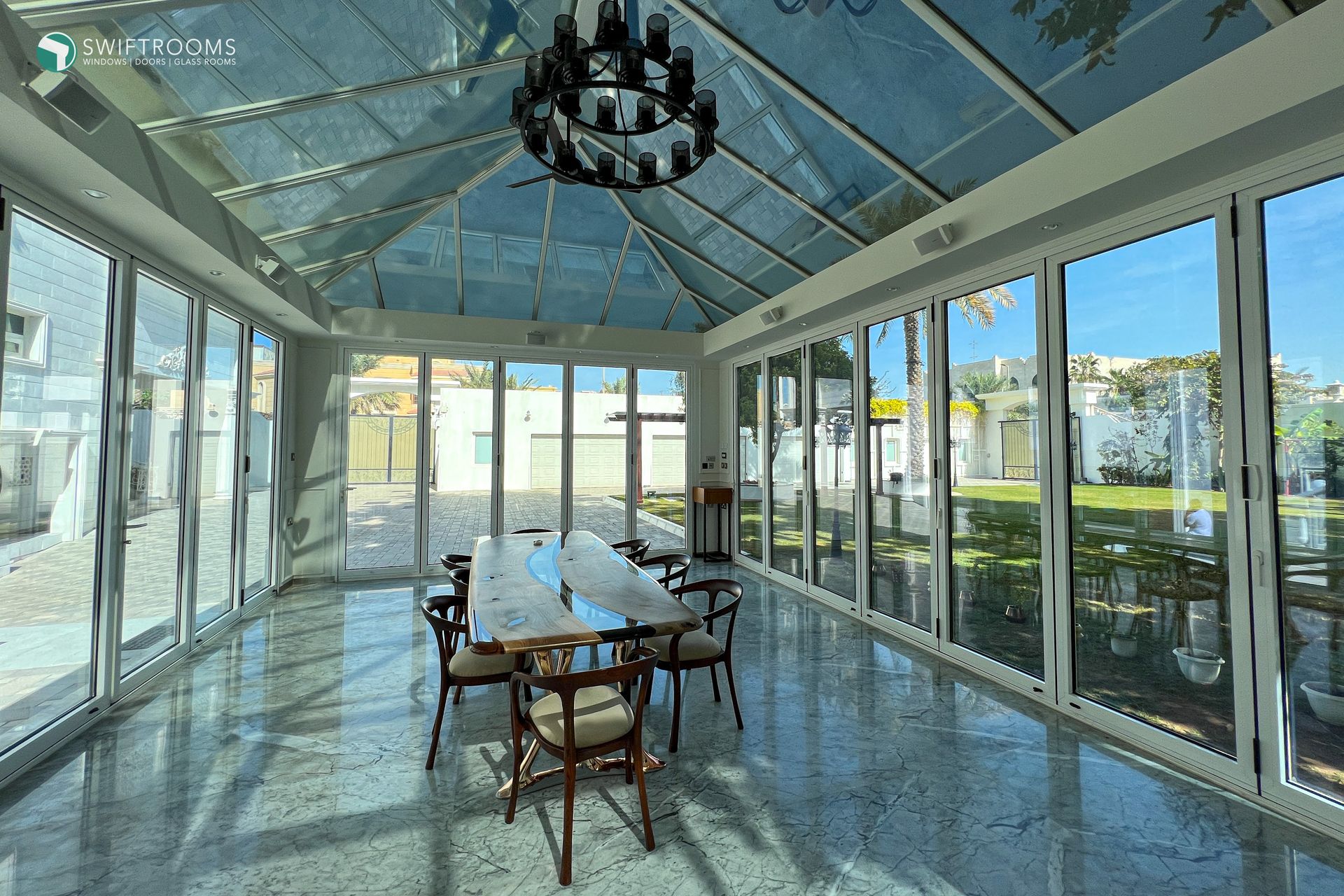 A large room with a table and chairs in it