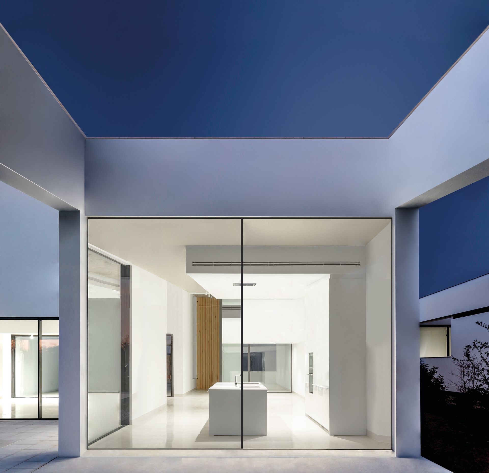 A white building with a blue sky behind it