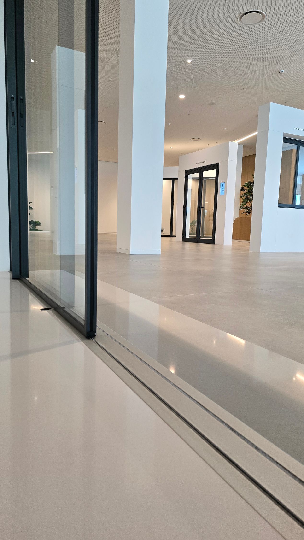 There is a sliding glass door in the middle of the room.
