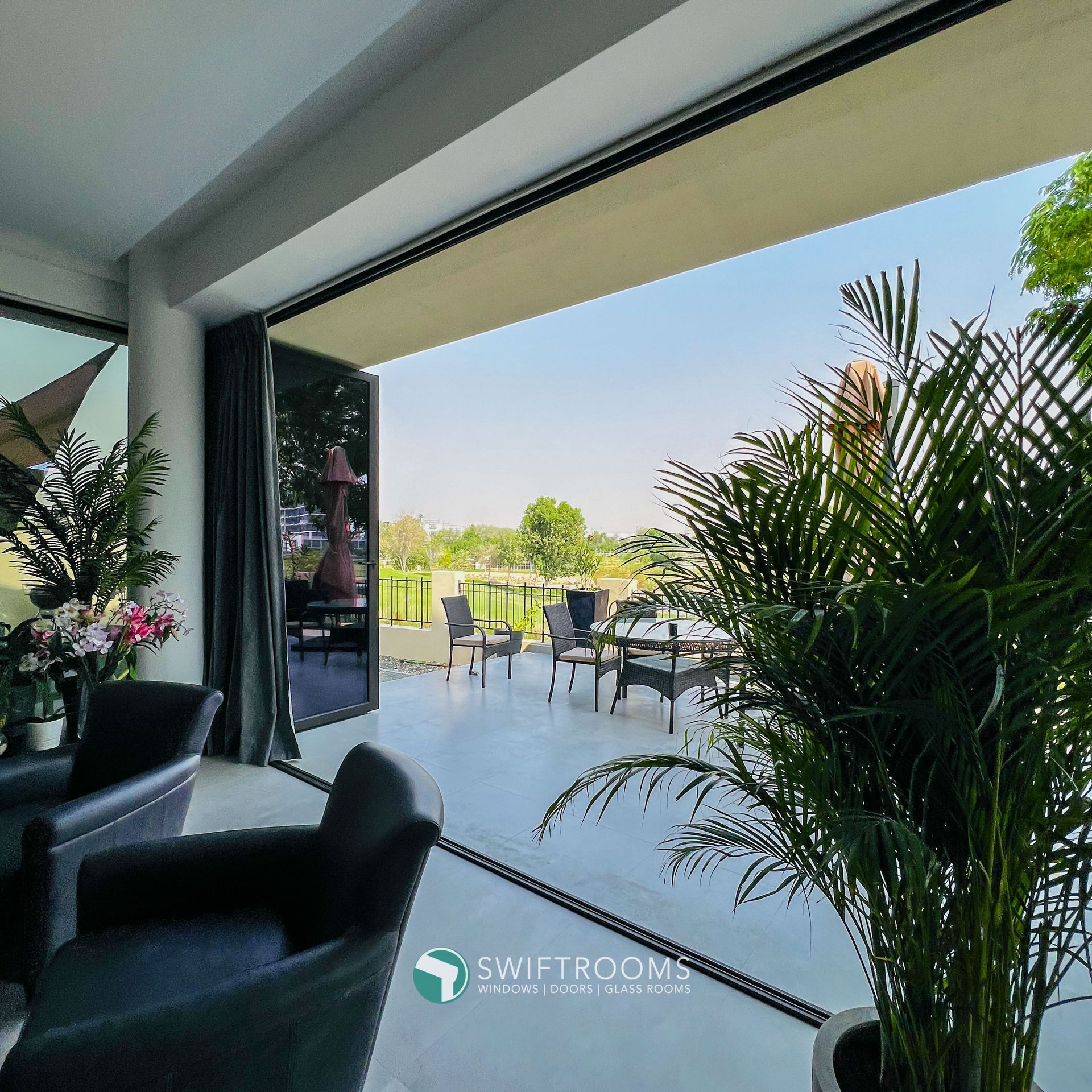 A living room with a sliding glass door leading to a patio
