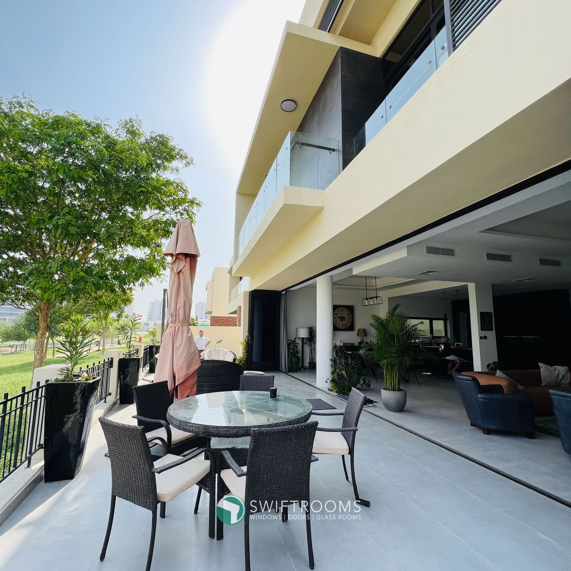 A large house with a table and chairs outside