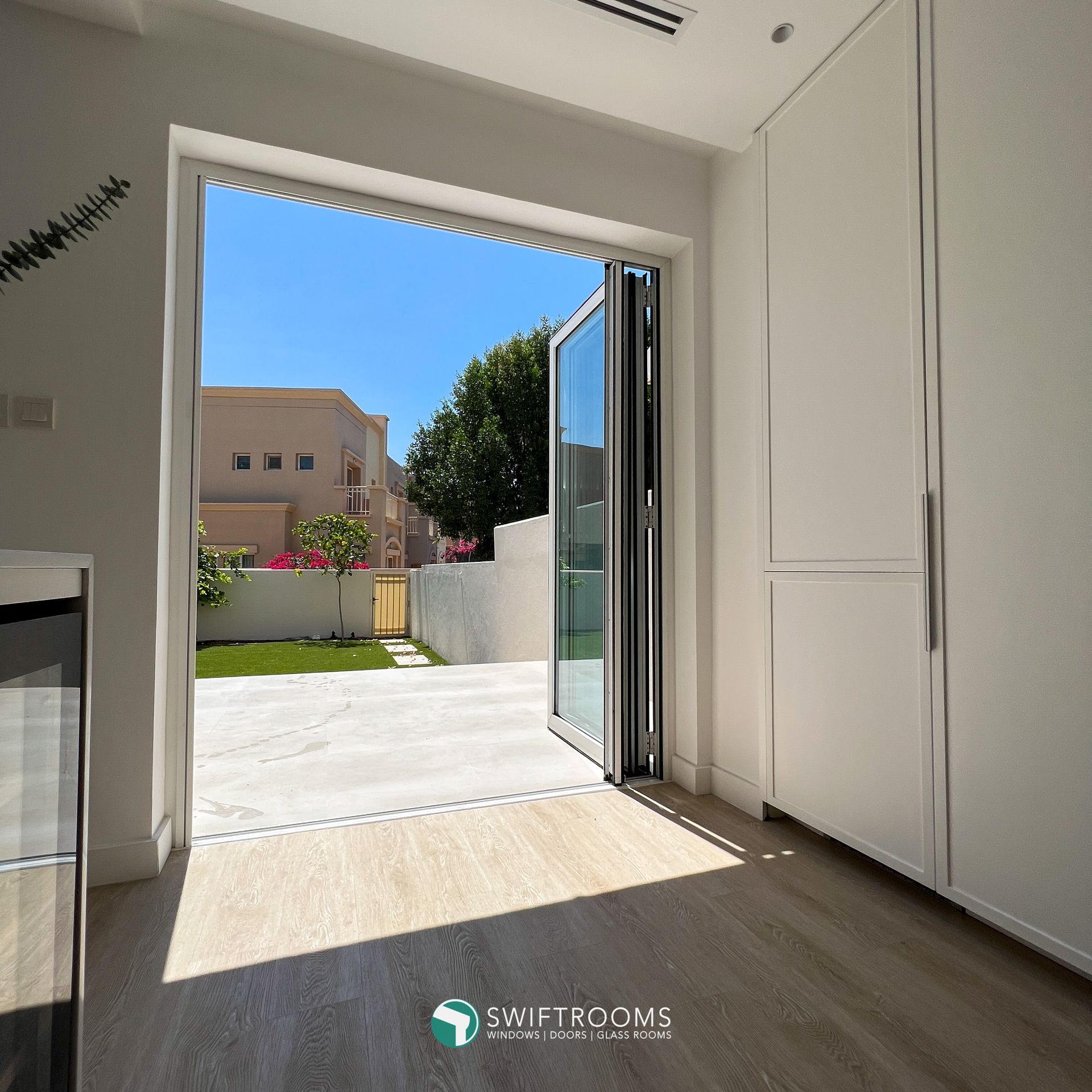 A room with a sliding glass door that says shiftrooms on it