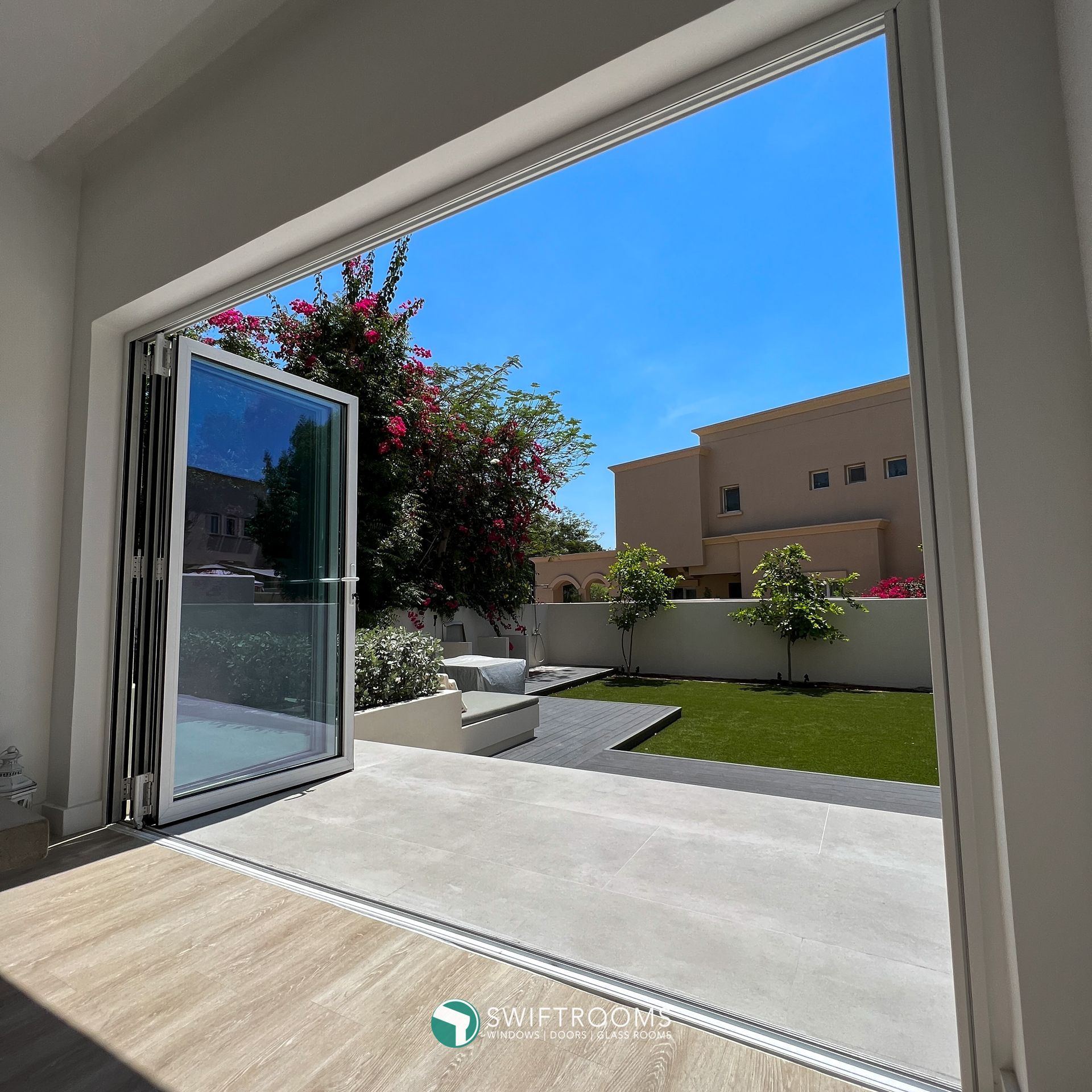 A view of a backyard through a sliding glass door