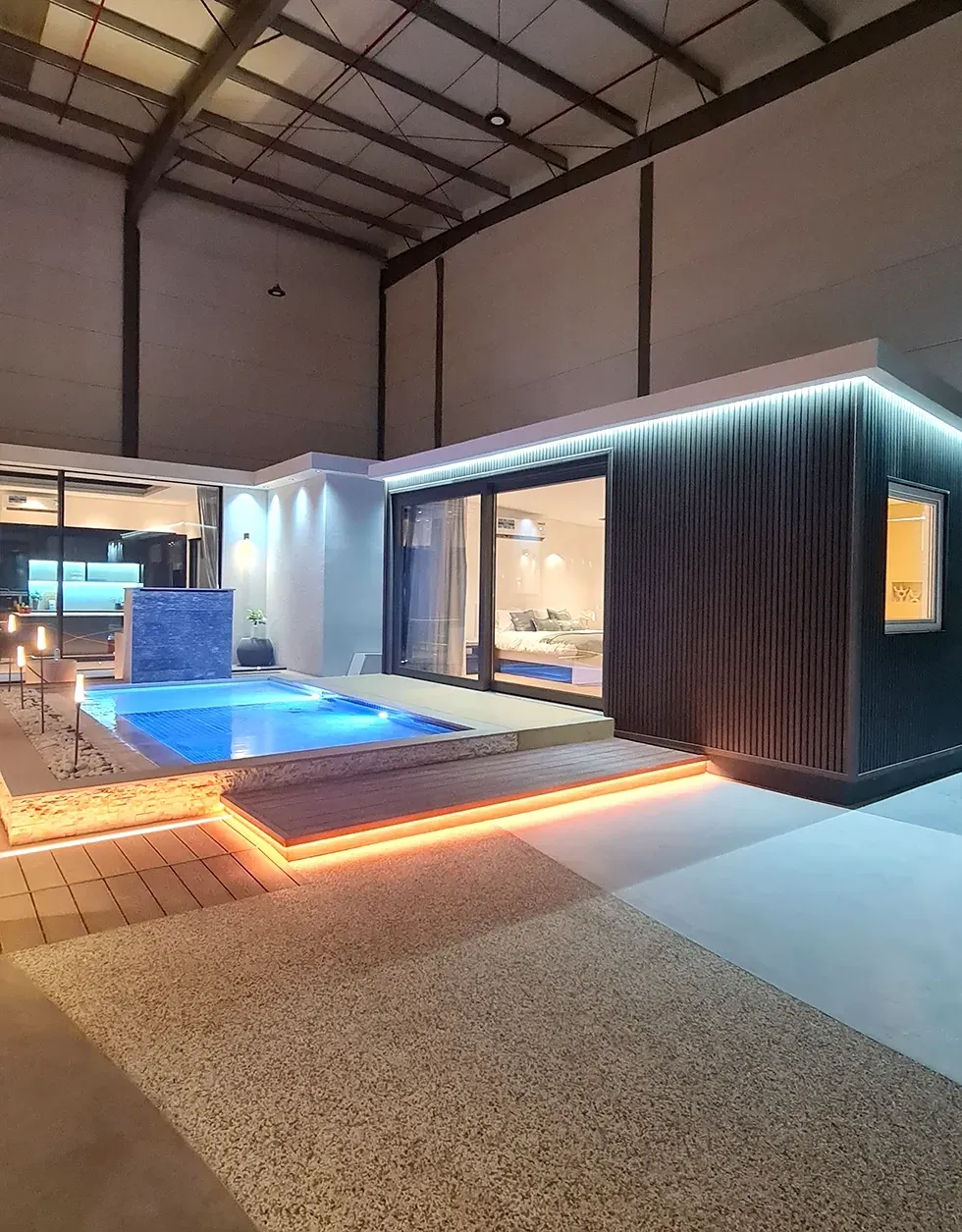 A house with a swimming pool in the middle of it