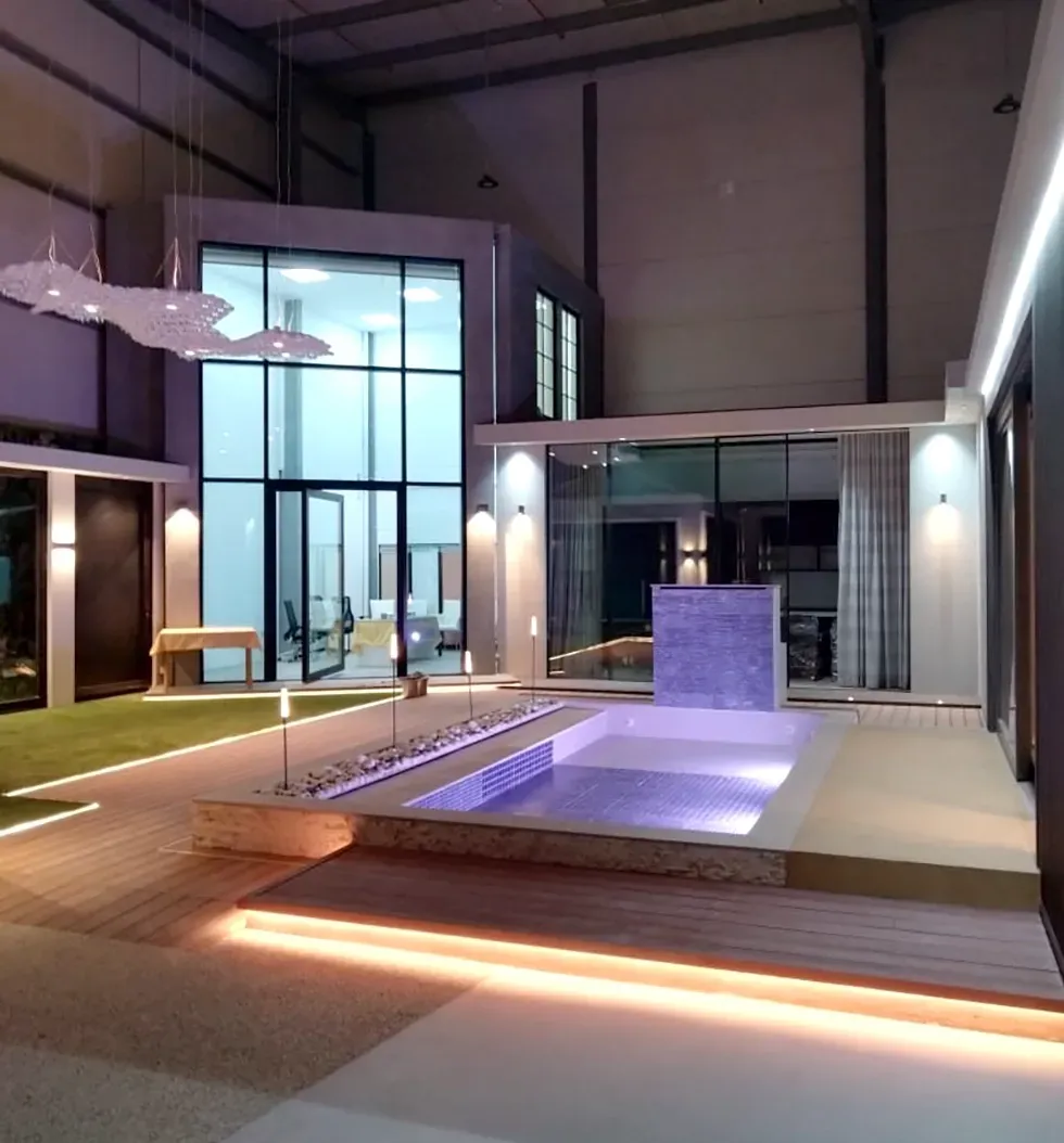 A large room with a pool in the middle of it