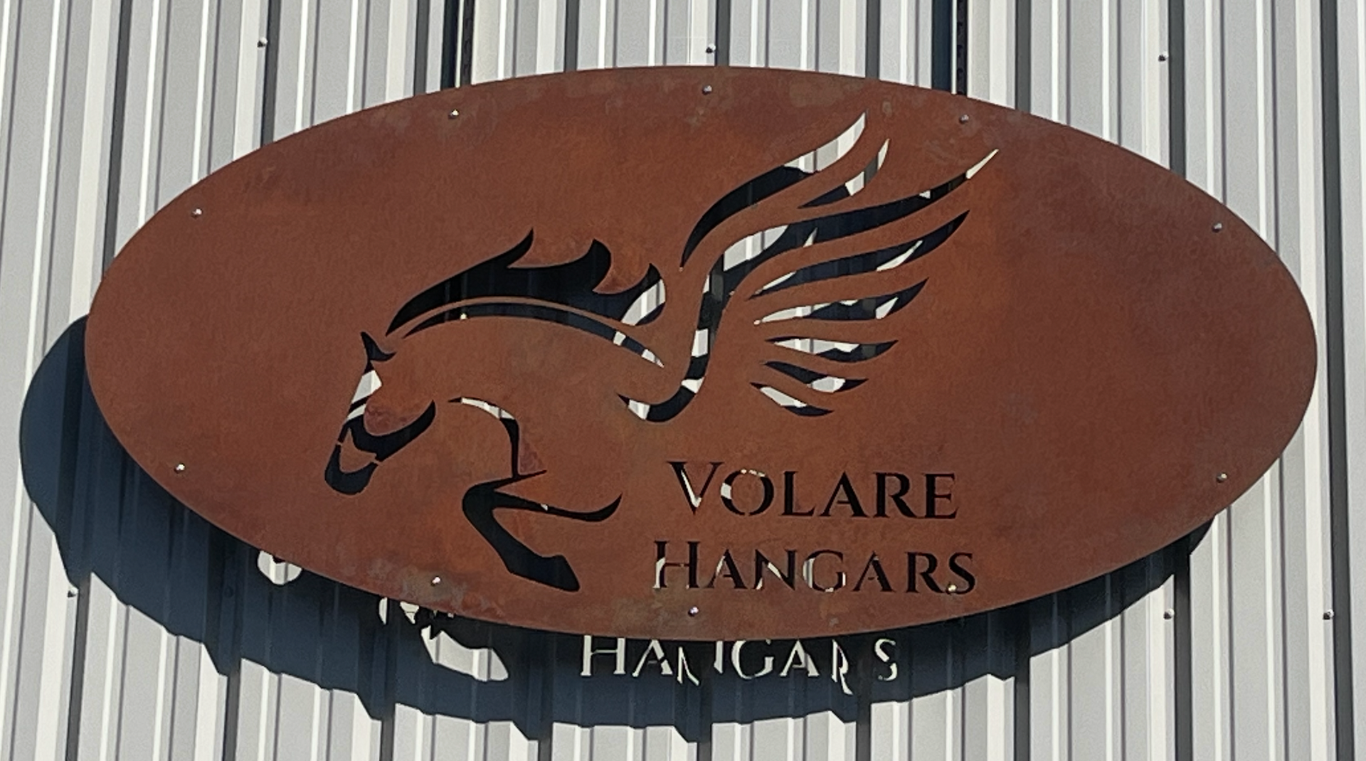 metal sign on a hangar wall