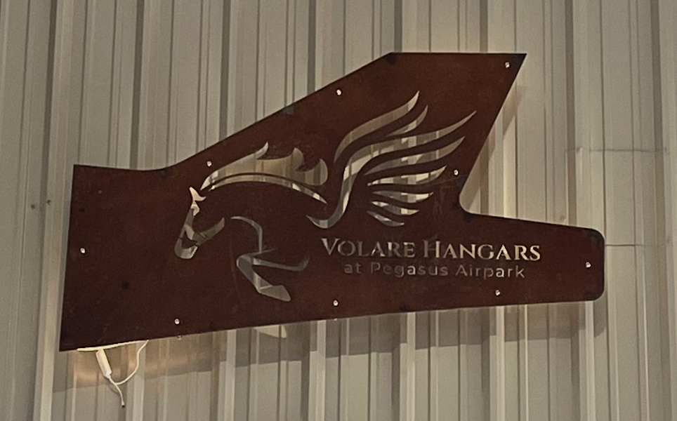 metal sign of an airplane tail