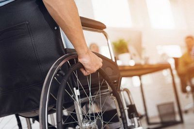 Personal Injury — An Injured Man Sitting on a Wheel Chair in Canton, OH