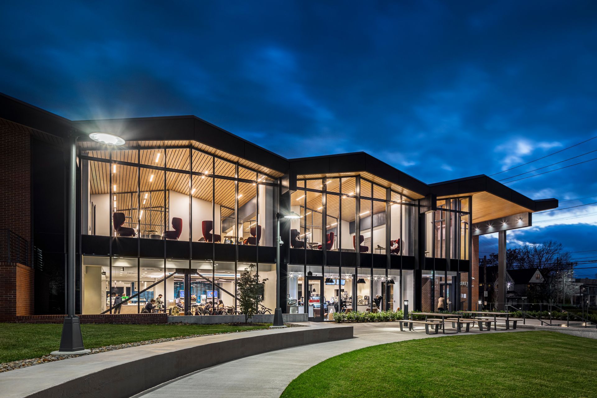 A large building with a lot of windows is lit up at night. Fribley Commons at Case Western Reserve University.