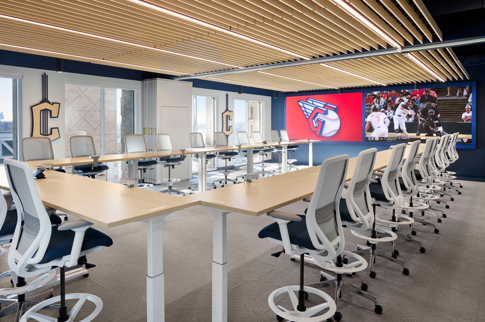 A lobby with a reception desk , chairs , and a coffee table.