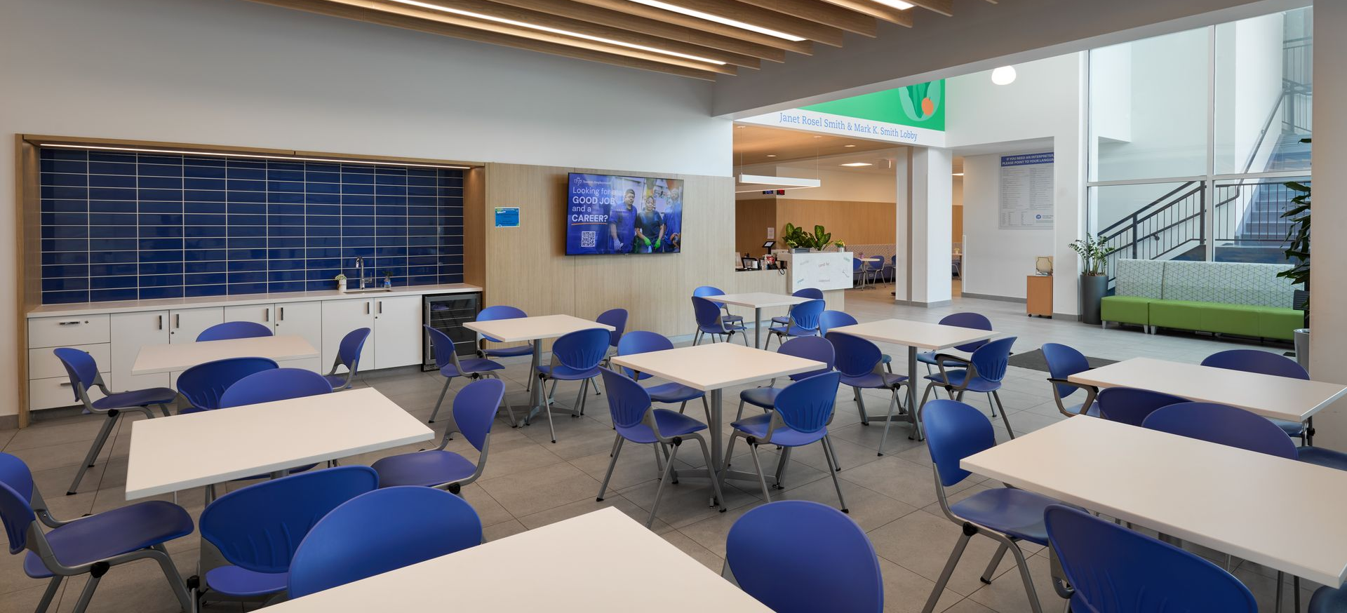 A man is pushing a shopping cart in the Greater Cleveland Food Bank Resource Center
