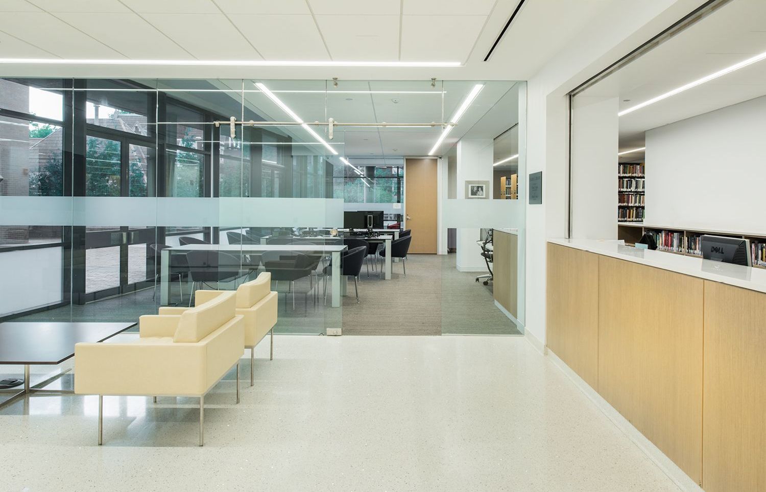 A large room with a couch and chairs in it