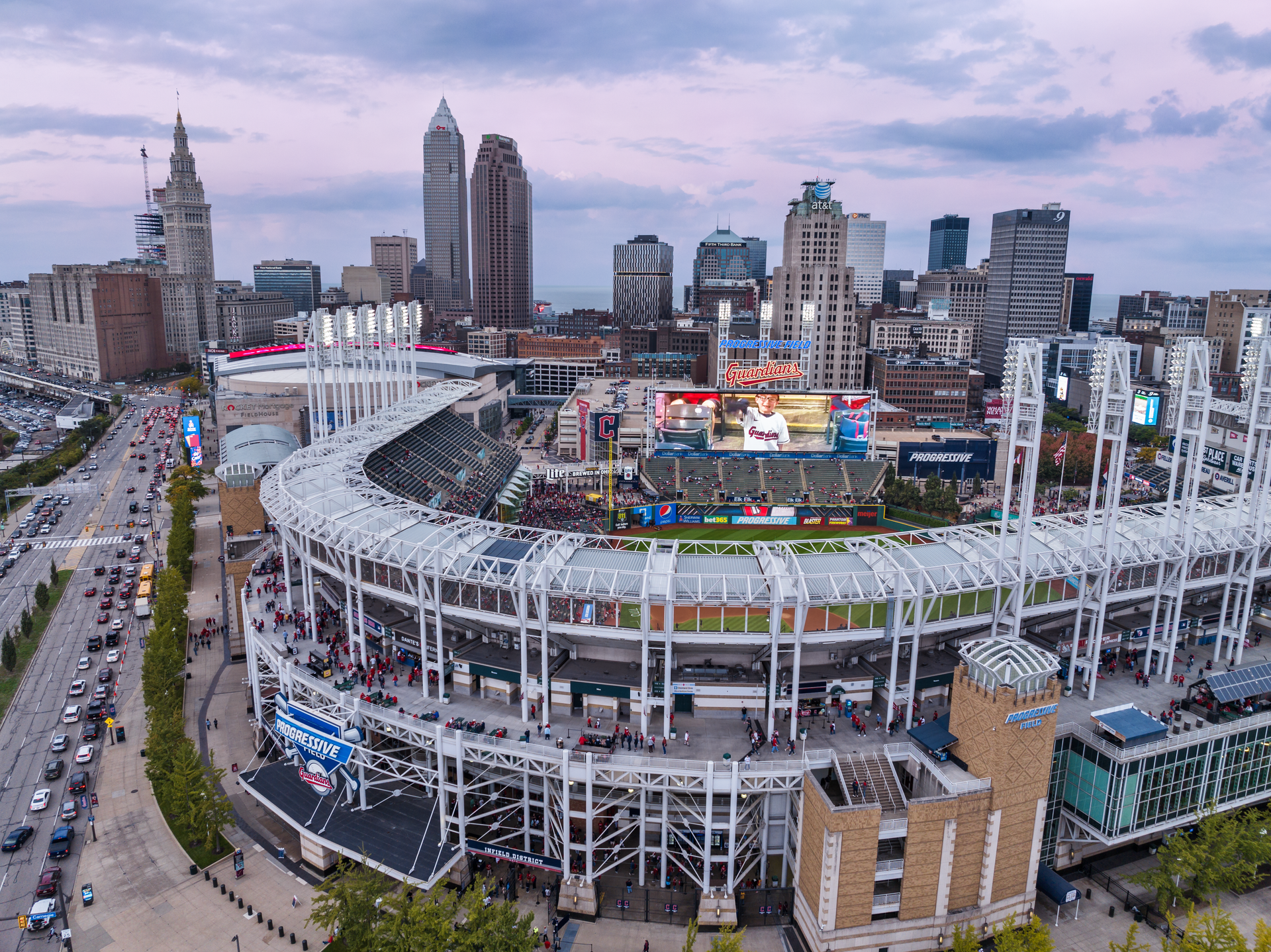 An aerial view of a baseball stadium filled with people watching a game.
