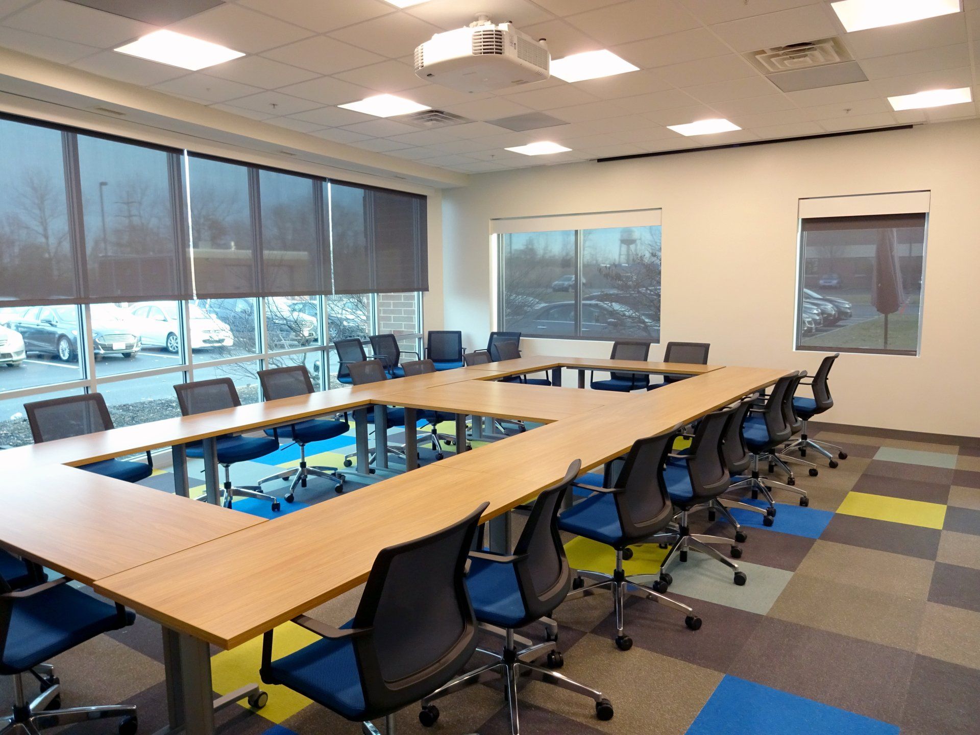 A conference room with a long table and chairs