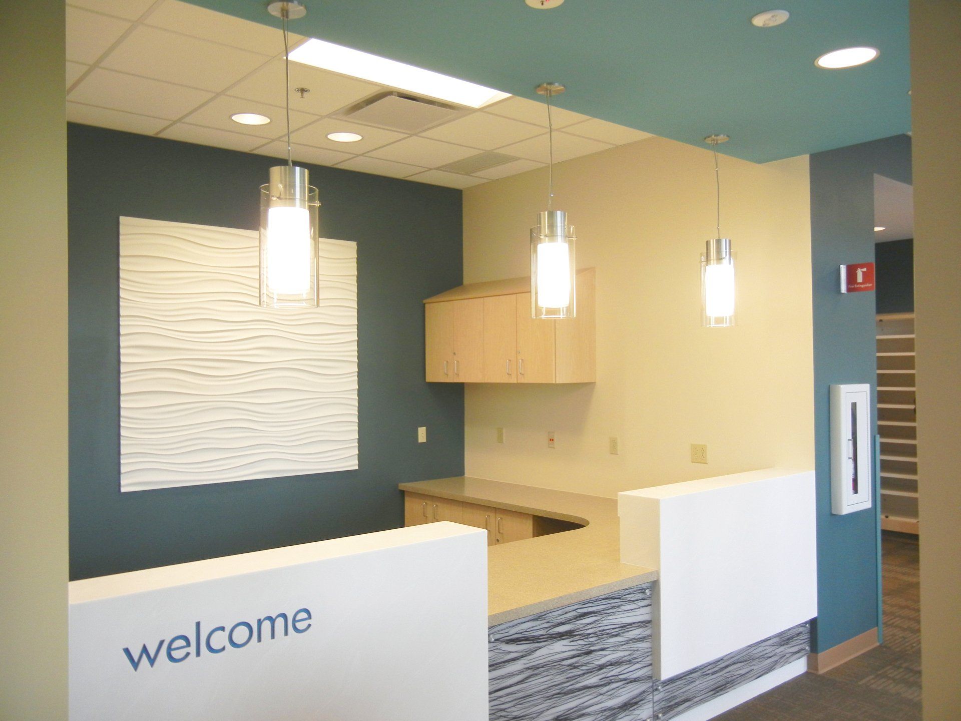 A reception area with a sign that says welcome