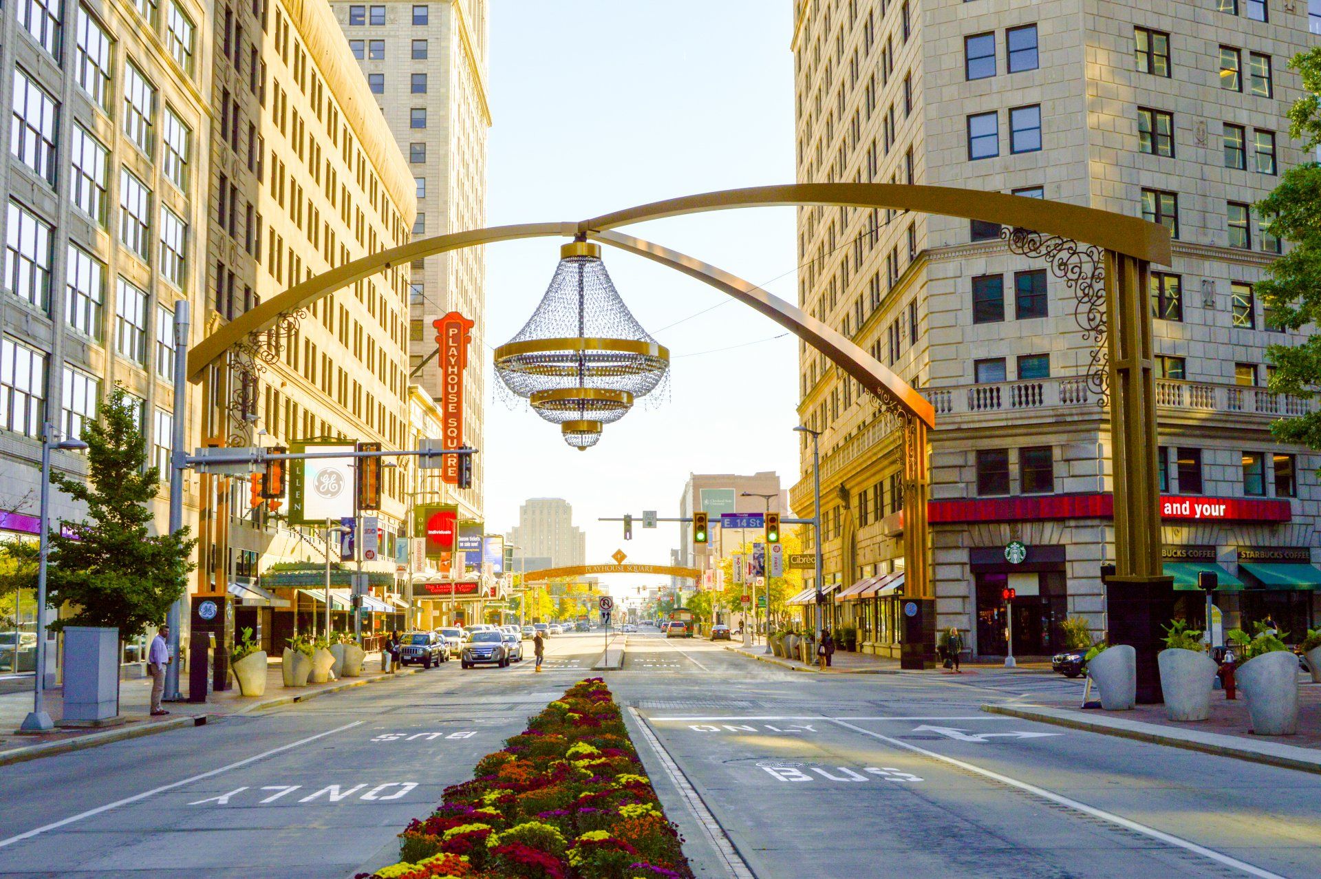 An empty city street with a chandelier hanging over it.