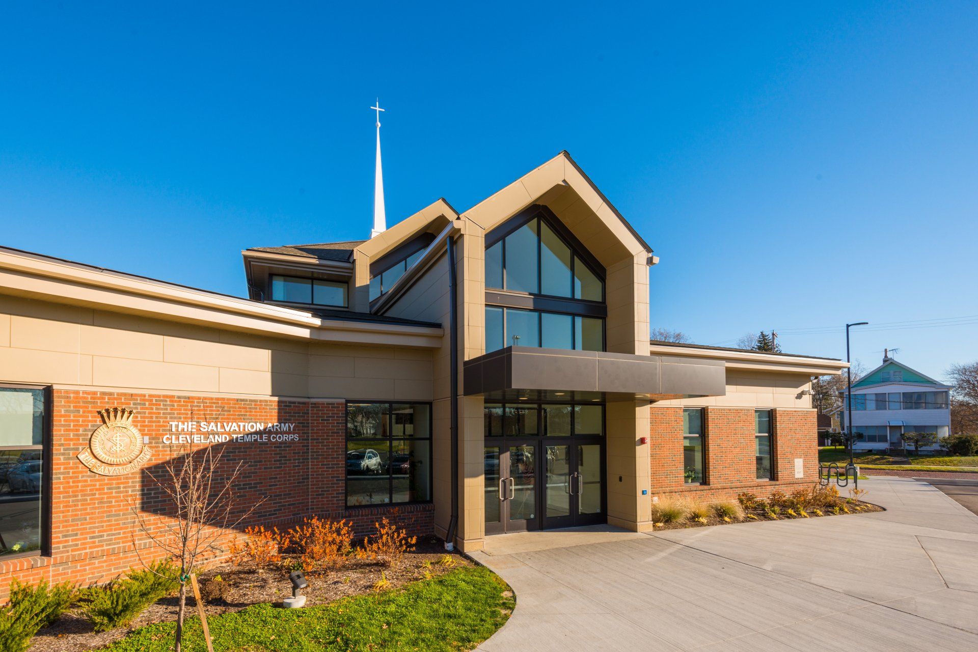 A large brick building with a steeple on top of it.