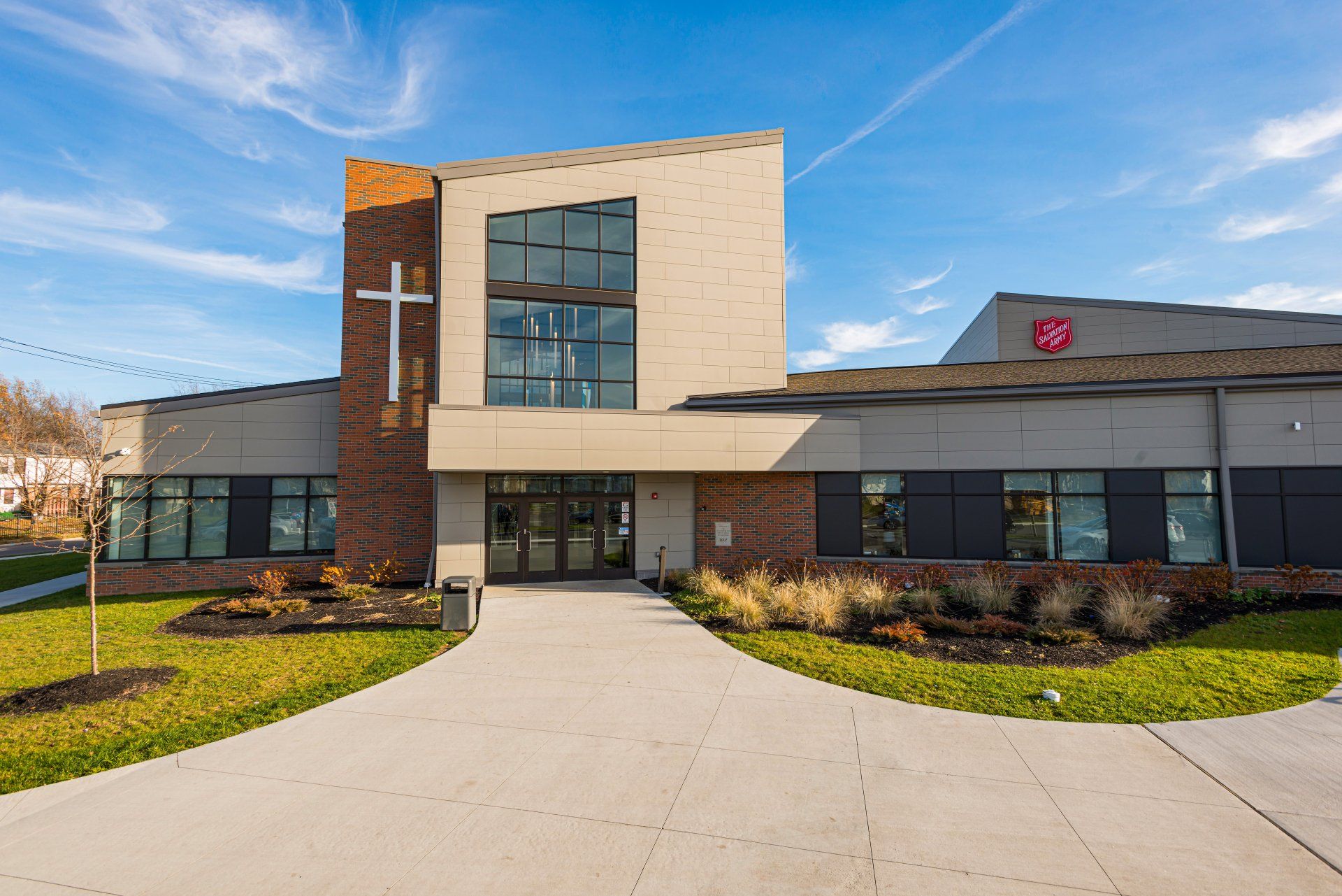 A large building with a cross on the top of it.