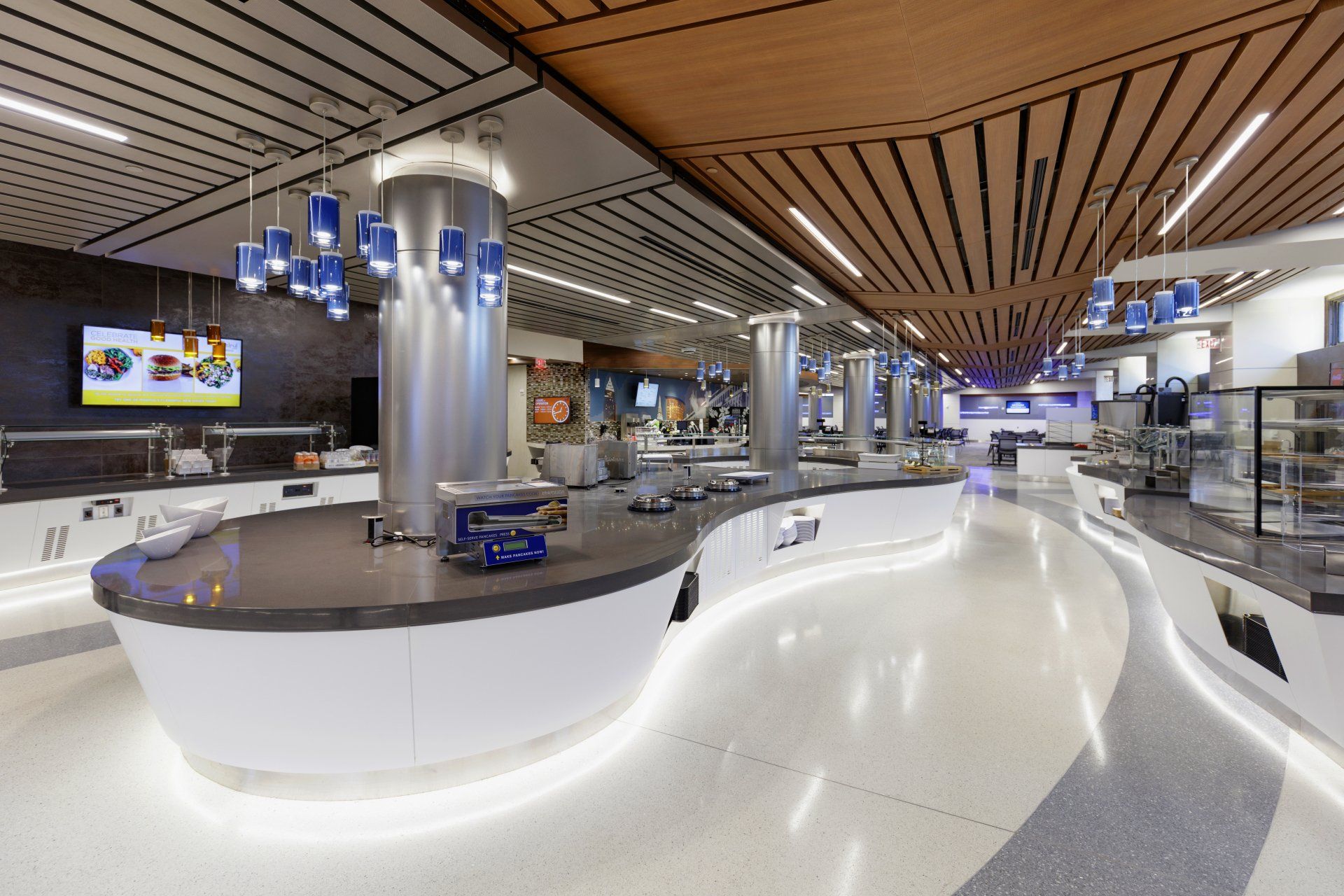 A large buffet area in a restaurant with a curved counter.