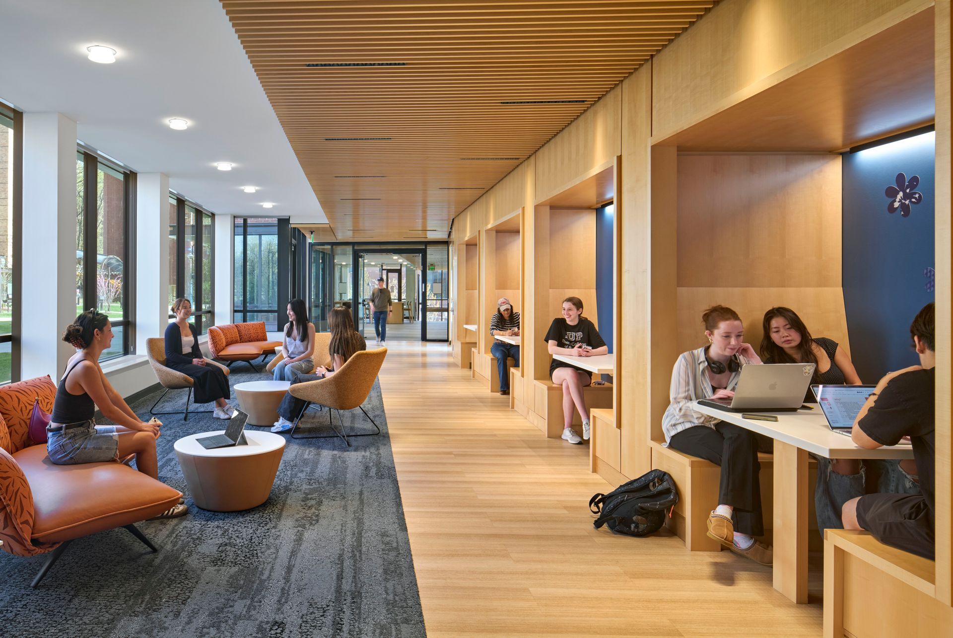 A large building with a lot of windows is lit up at night.