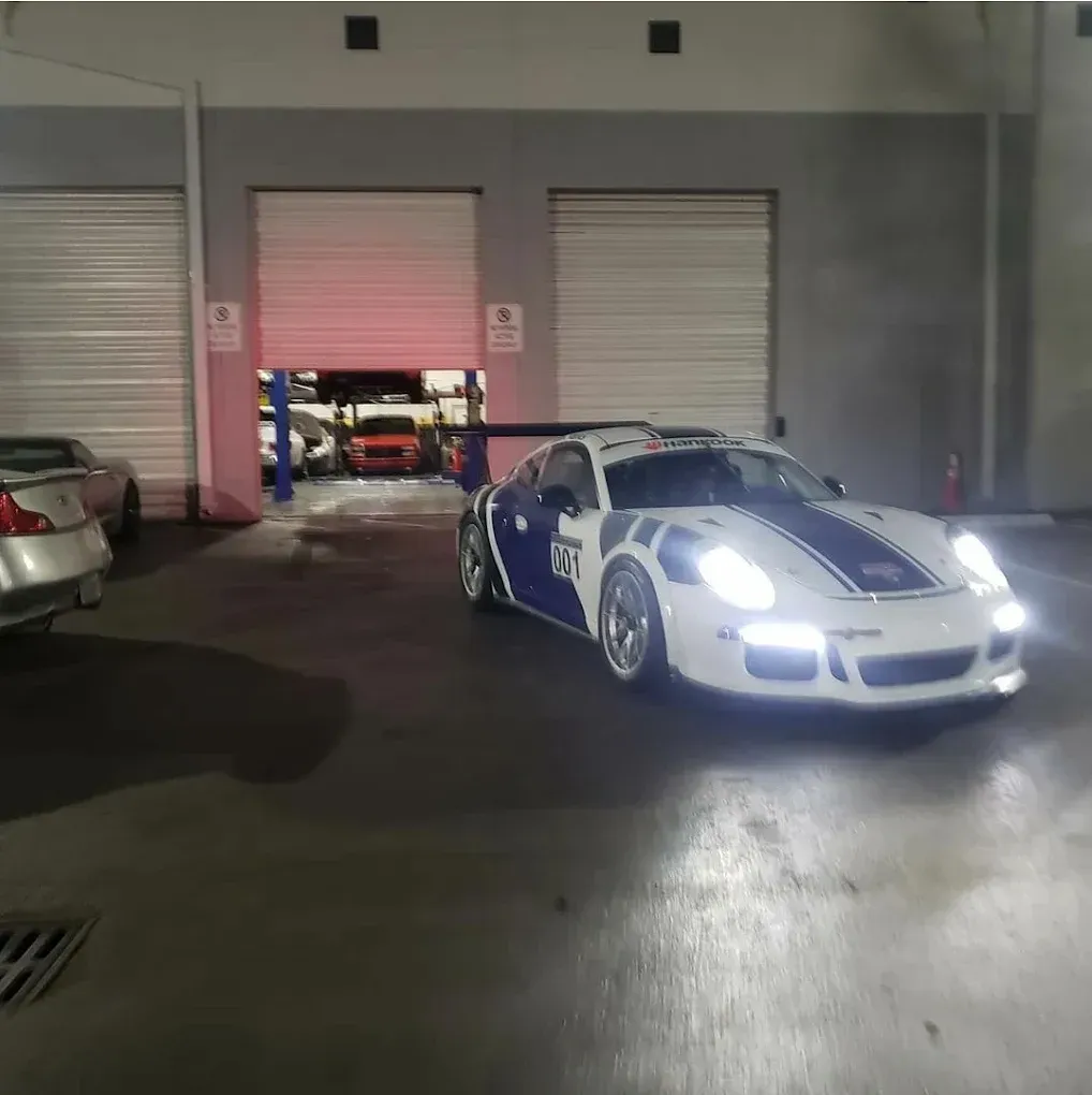 white car in the shop