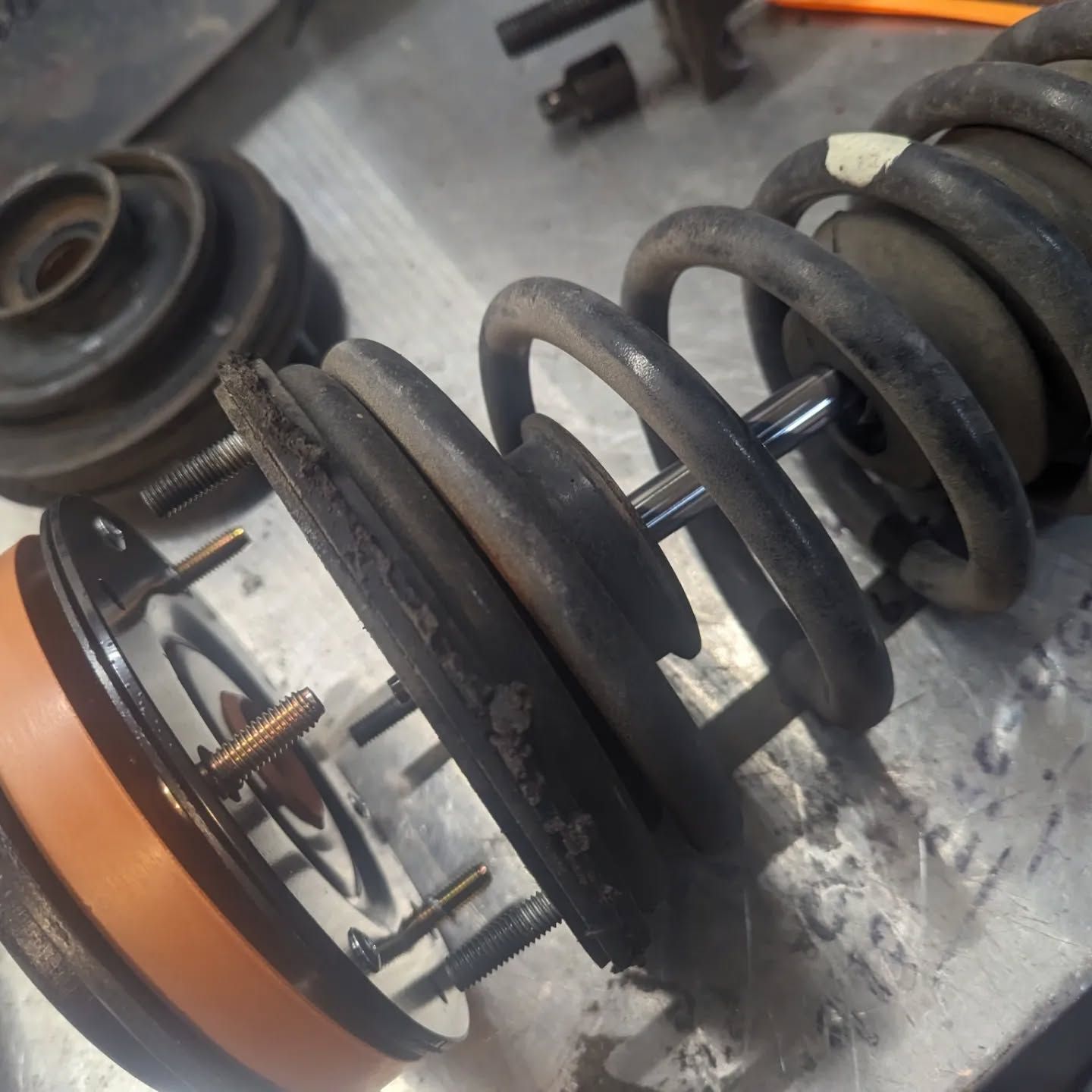 A close up of a shock absorber on a table