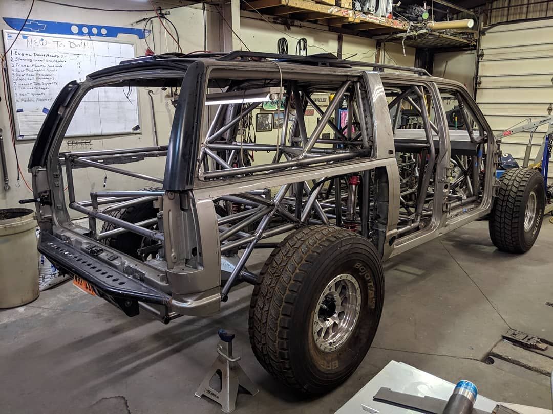 A car is being built in a garage.