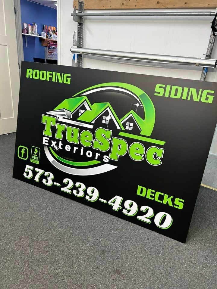A sign for true spec exteriors roofing siding and decks