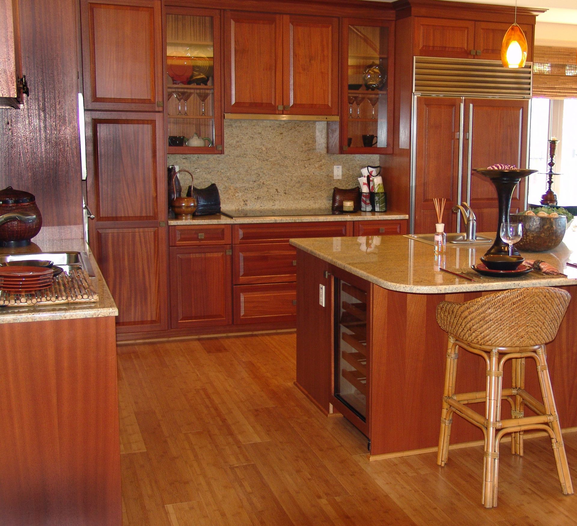 A kitchen with wooden cabinets and granite counter tops
