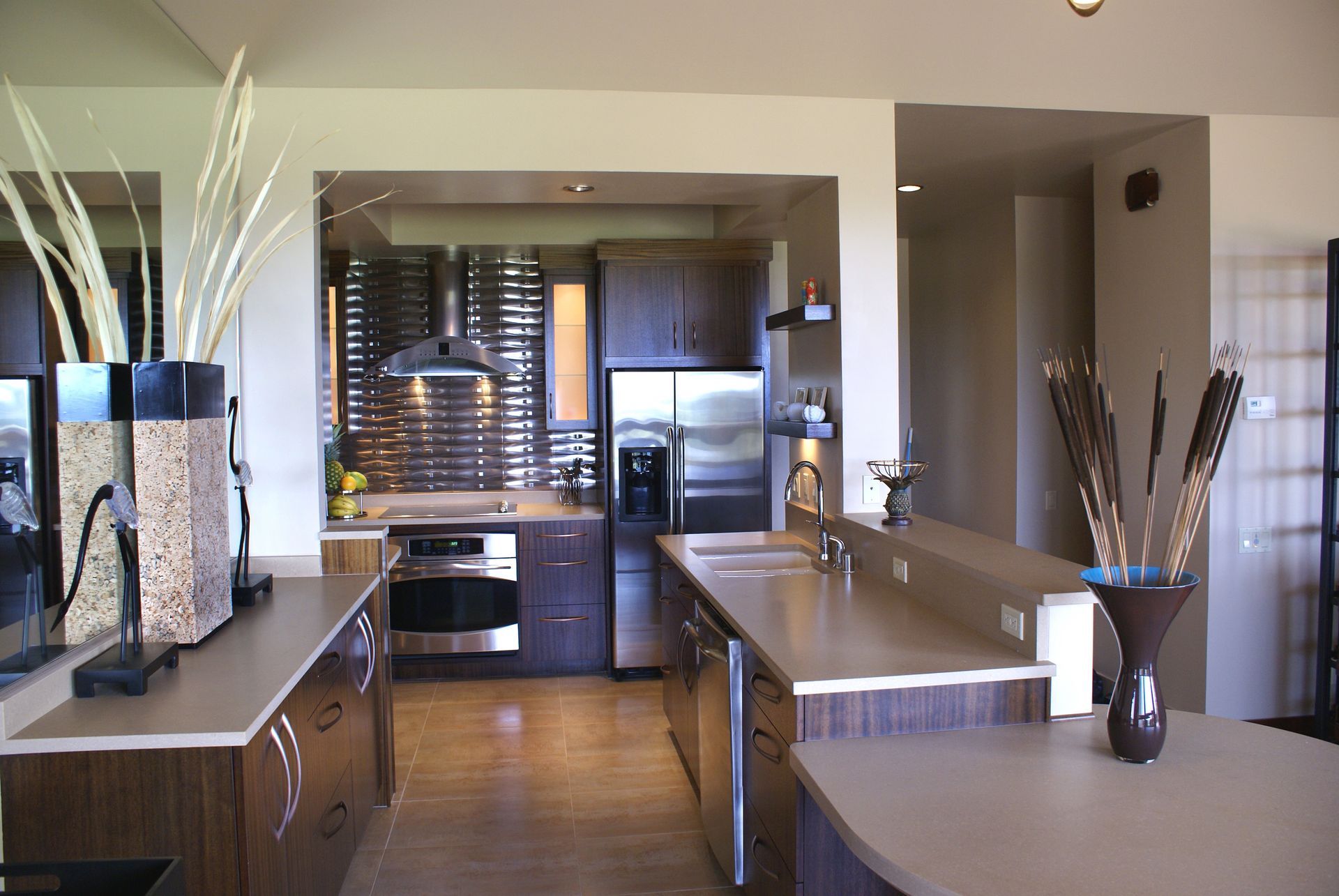 A kitchen with stainless steel appliances and a large island