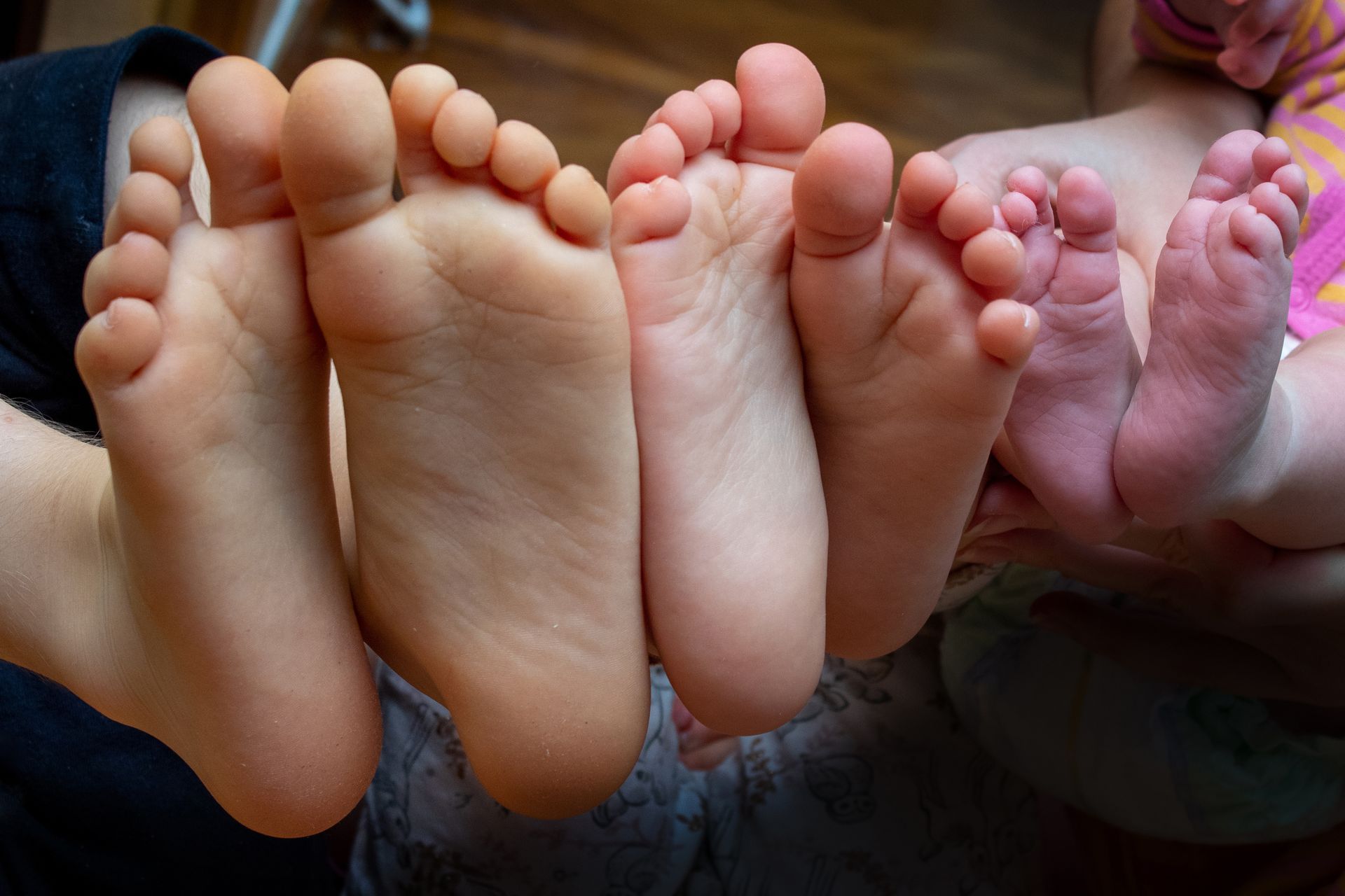 Child podiatrist in Newcastle assessing a young patient’s feet to check for flat feet, toe walking, 