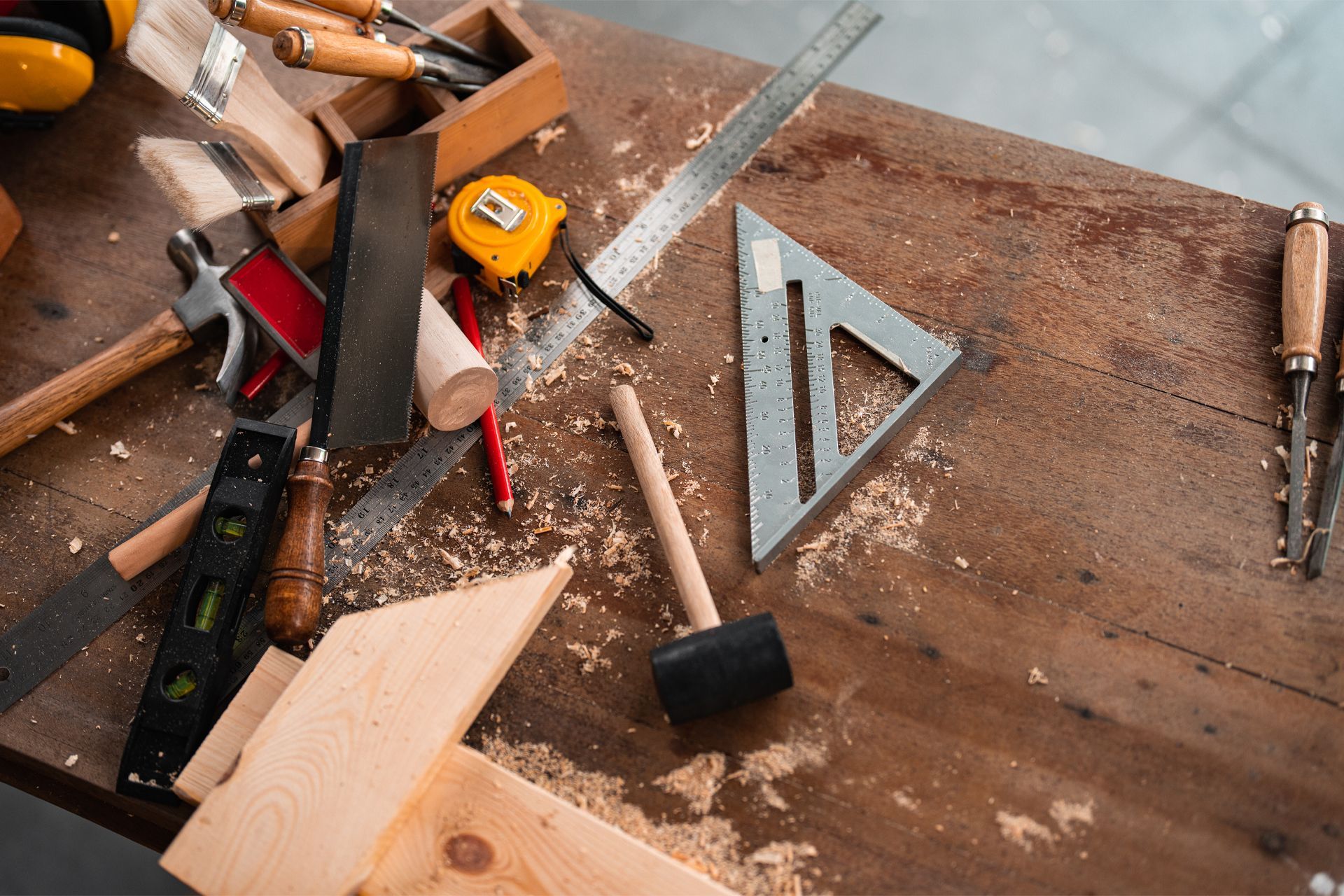 A wooden table with a lot of tools on it.