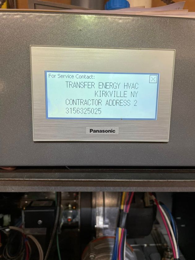 A Panasonic industrial control panel displaying the text: 