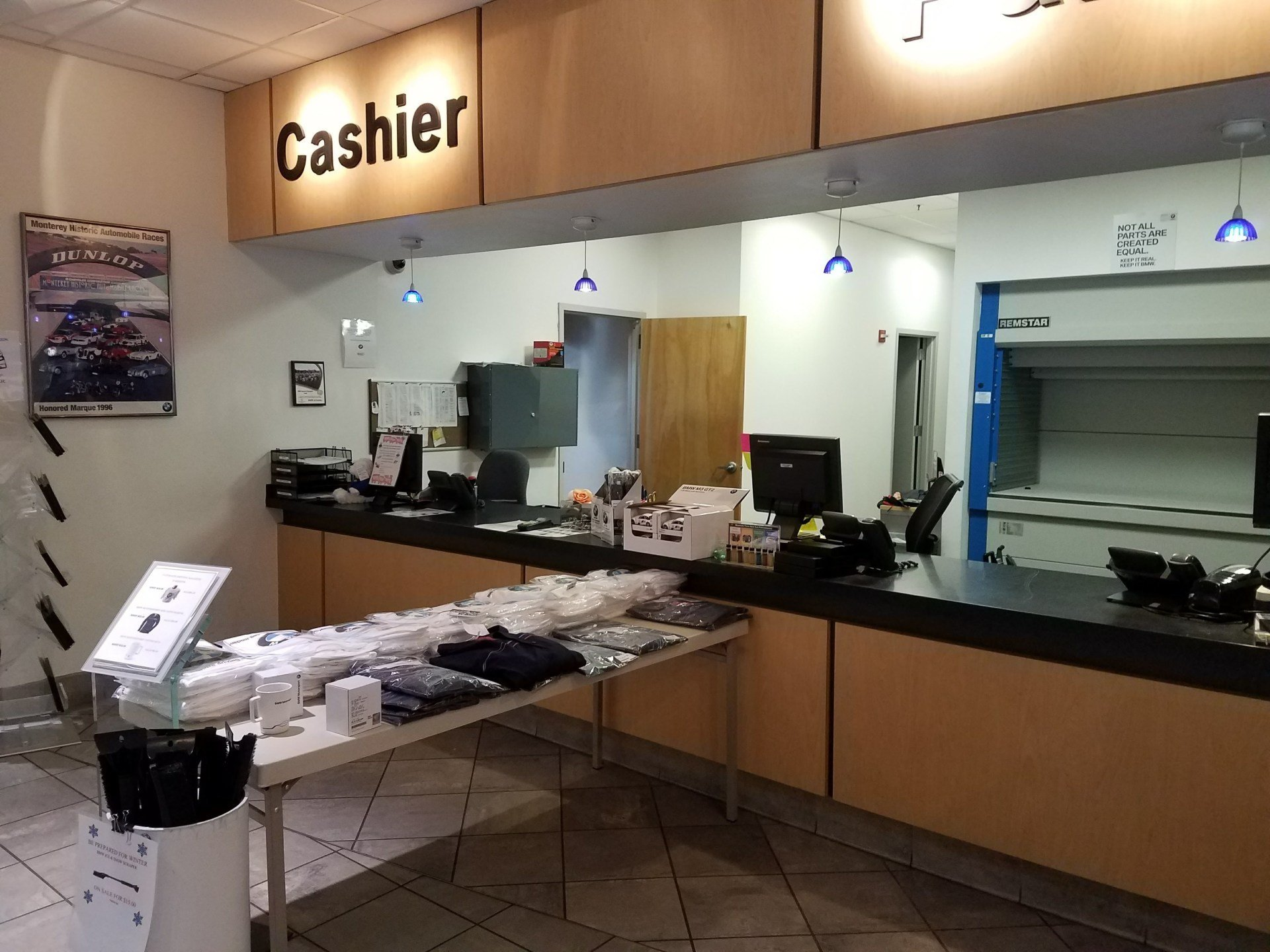 A counter in a store with a sign that says cashier