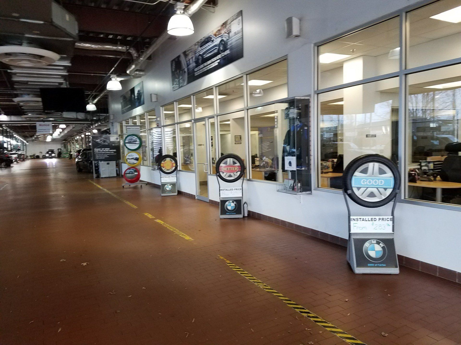 A large building with a lot of windows and tires on display.