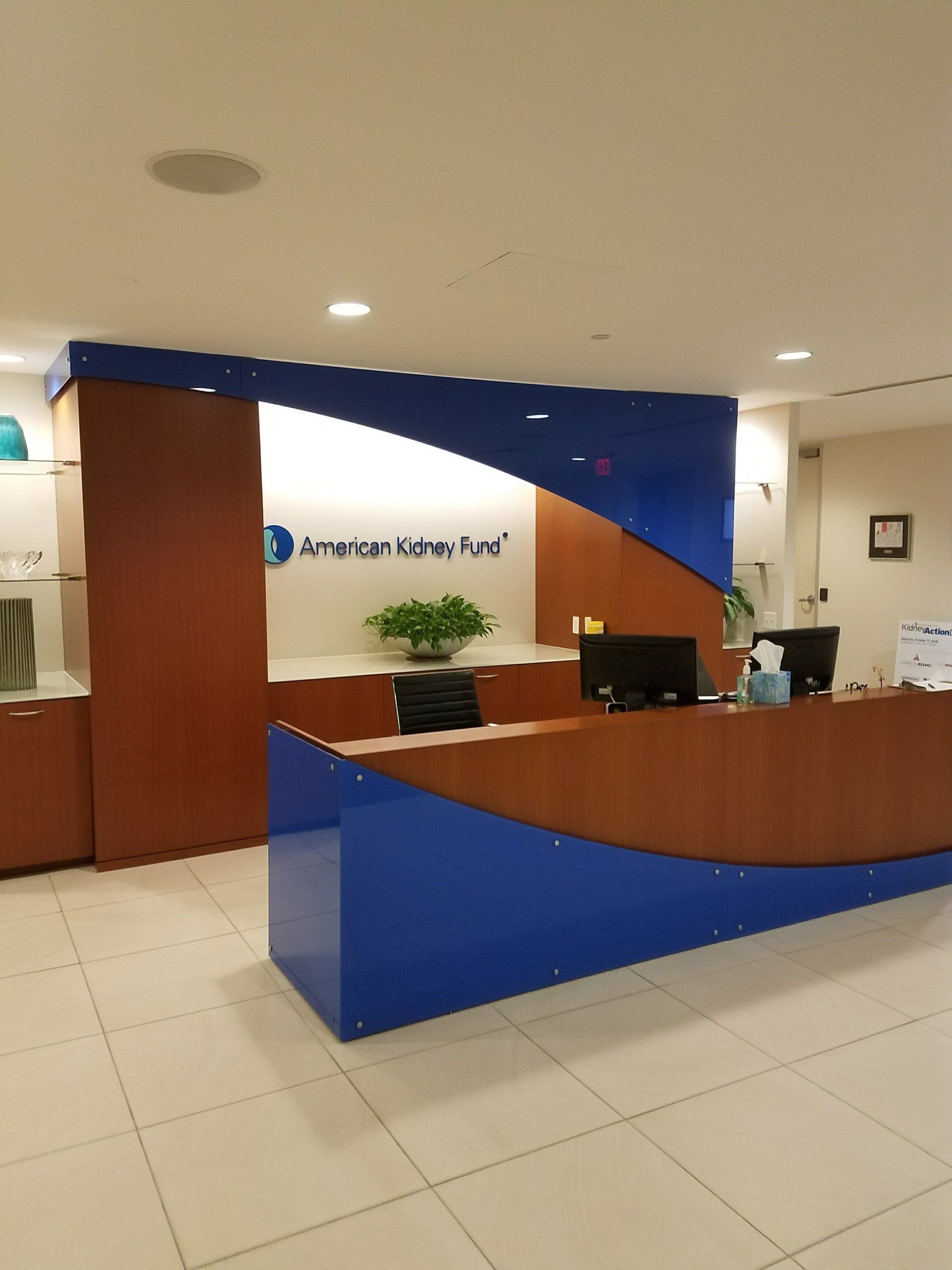 A blue and brown reception desk in a hospital