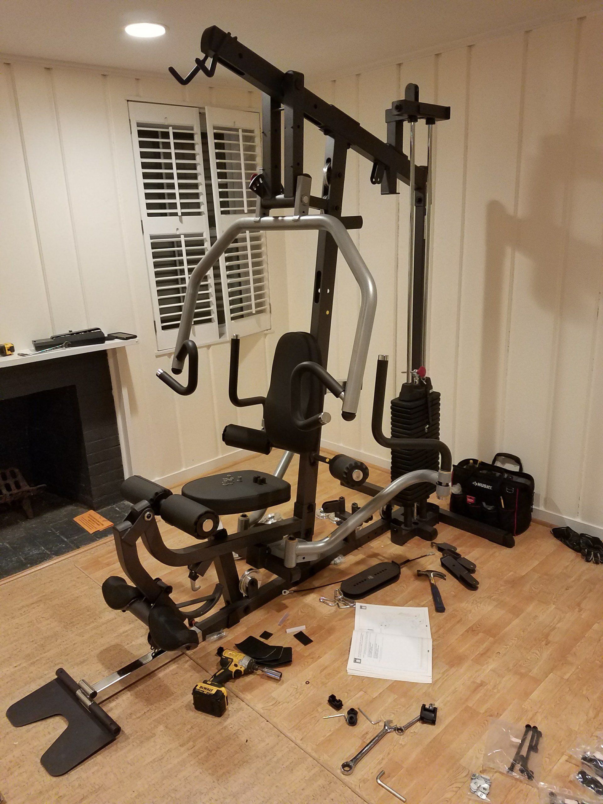 A home gym is being built in a living room.